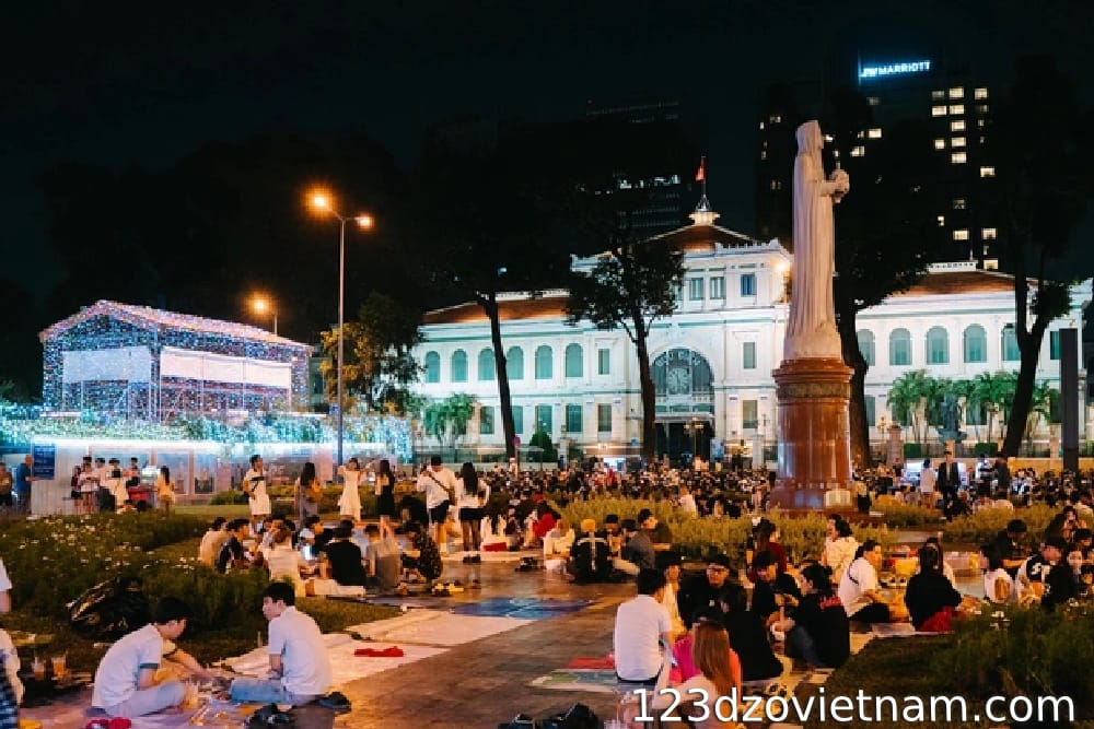 Sitting at a sidewalk cafe near Notre Dame Cathedral in Saigon