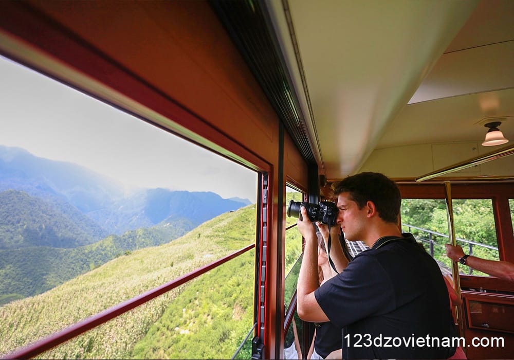 Large windows offer stunning views of the valley