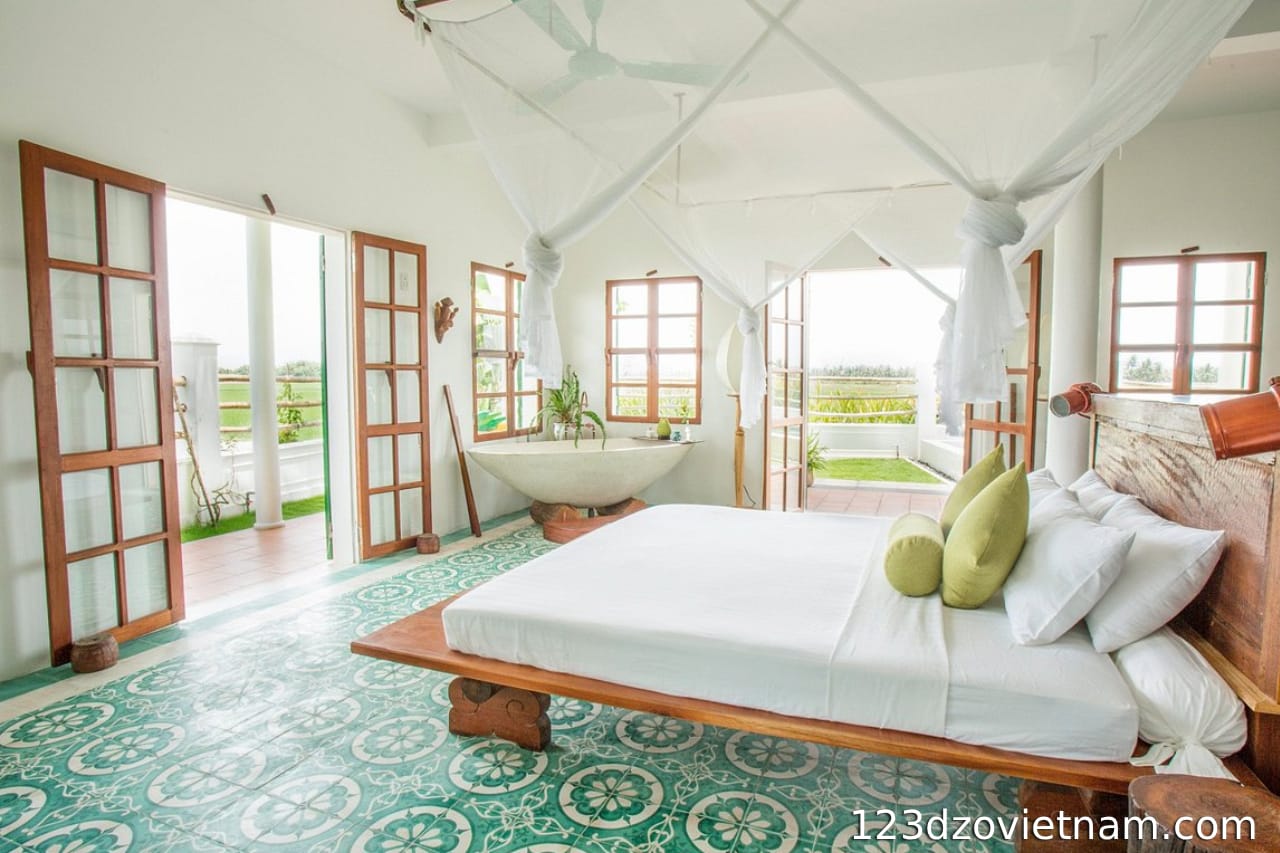 The bedroom at Seasnails Homestay is filled with natural light