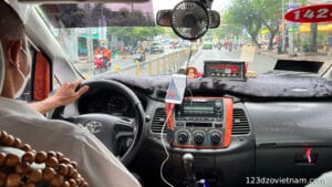 Inside of the Grab Taxi, Driver driving the Cab
